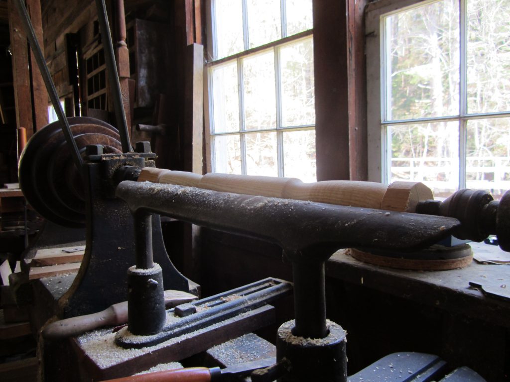 A wooden fram lathe at Hanford Mills Museum